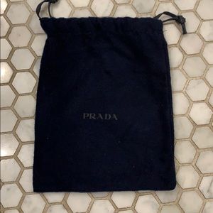 Navy blue Prada dust bag from a belt